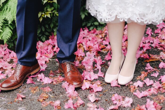 Bride And Grooms Feet Standing on Flower Pedals