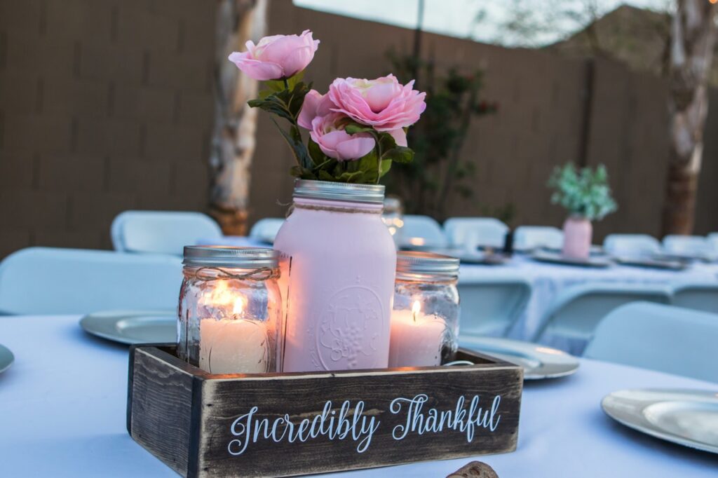 Mason Jars in Centerpiece for Wedding With Candles