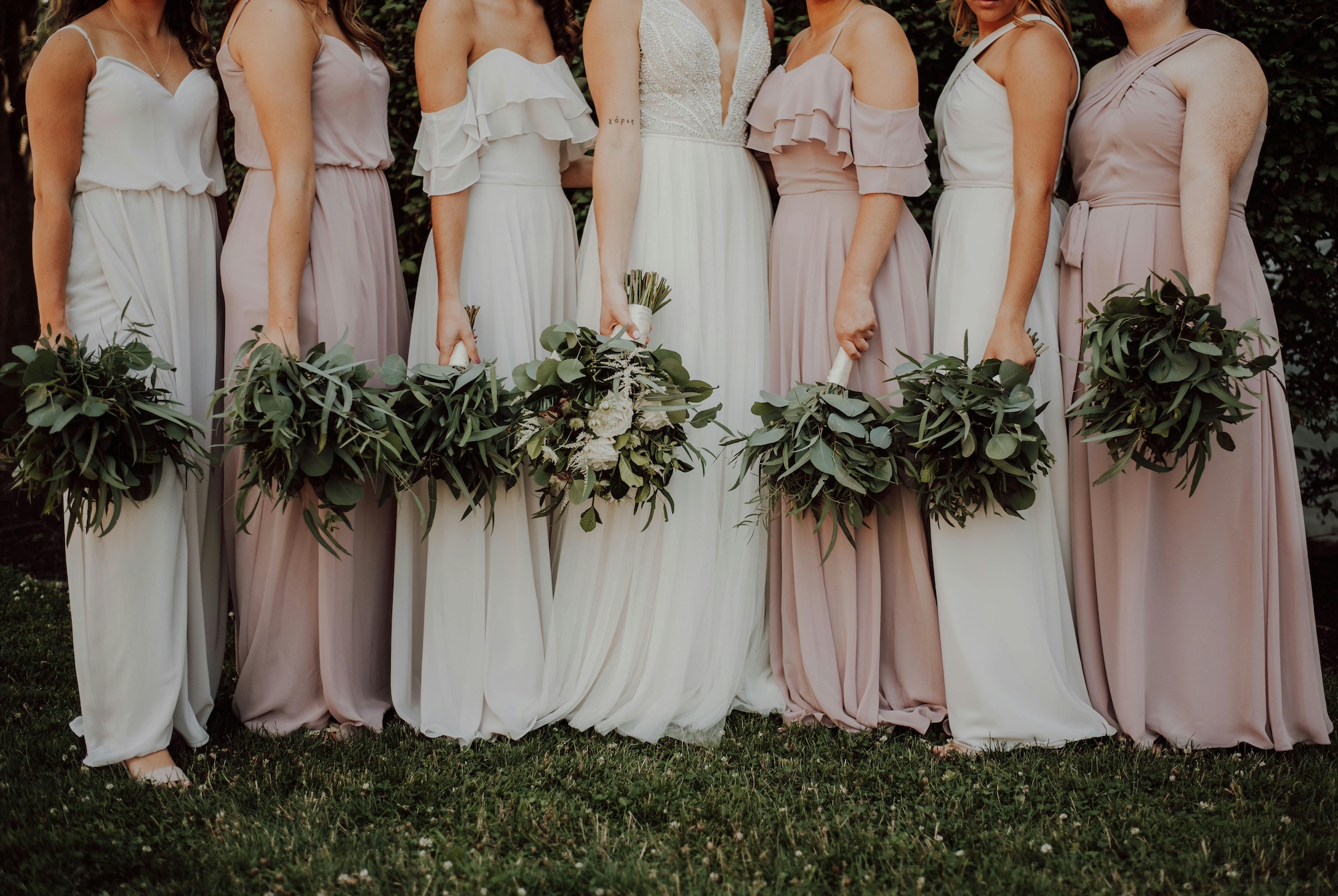 Bride with bridesmaids next to her